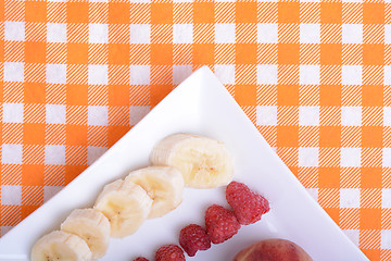 Image showing peach raspberries bananas close up as health food concept