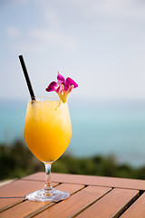 Image showing Pineapple juice at restaurant beside sea