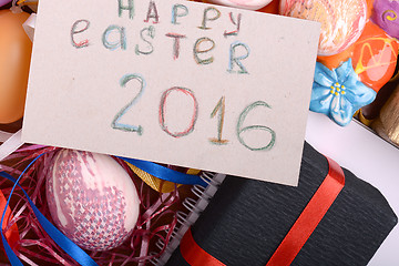 Image showing Easter background with eggs, ribbons and spring decoration