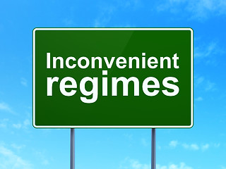 Image showing Political concept: Inconvenient Regimes on road sign background