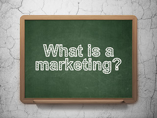 Image showing Advertising concept: What is a Marketing? on chalkboard background