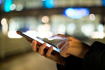 Image showing Woman finger touch on blank screen of cellphone