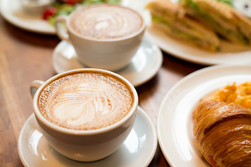 Image showing Breakfast with coffee and croissants