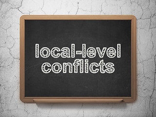 Image showing Political concept: Local-level Conflicts on chalkboard background