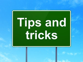 Image showing Studying concept: Tips And Tricks on road sign background
