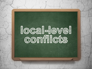 Image showing Politics concept: Local-level Conflicts on chalkboard background