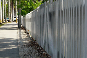 Image showing white picket fence along sidewalk