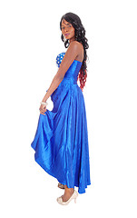 Image showing African American woman in blue dress in profile.