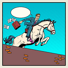 Image showing Businessman horseman on horse jumps over barrier