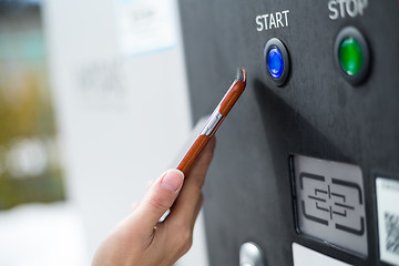 Image showing Customer paying with NFC technology on parking system