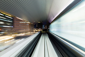 Image showing Fast train through city