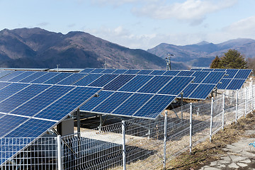 Image showing Solar panel with mountain range background