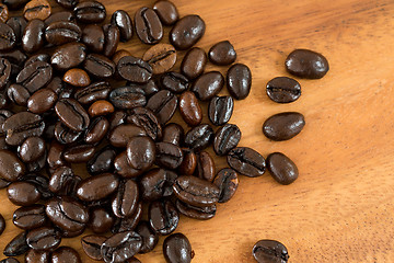 Image showing Coffee bean over wooden background