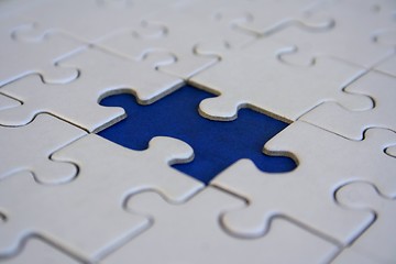 Image showing Final blue jigsaw piece