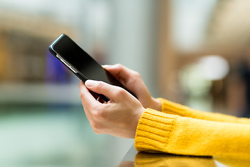 Image showing Close up of girl using mobile smart phone