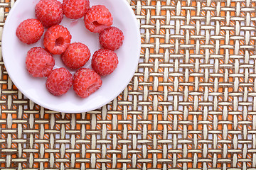 Image showing Big Pile of Fresh Raspberries in the White Bowl