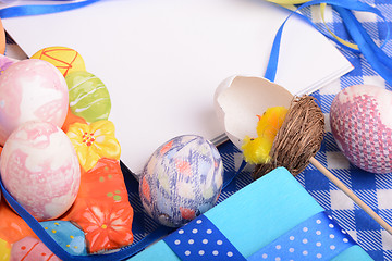 Image showing Assorted Easter coloured eggs in the paper egg box