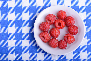 Image showing Big Pile of Fresh Raspberries in the White Bowl