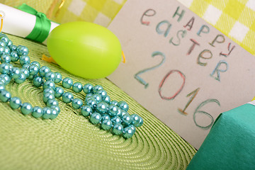 Image showing Easter eggs and invitation note. happy easter