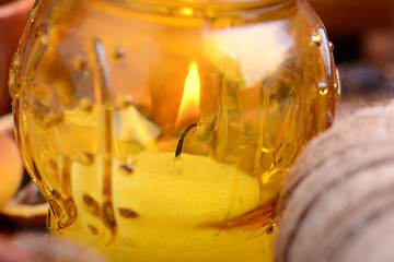 Image showing candles in glass burning romantic celecration concept wooden kitchen close up