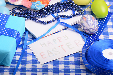 Image showing Easter eggs and invitation note. happy easter