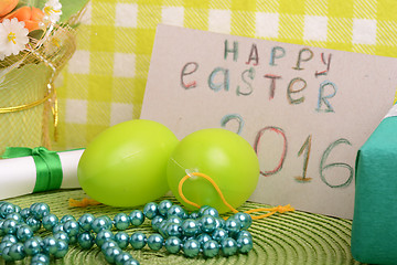 Image showing Easter eggs and invitation note. happy easter