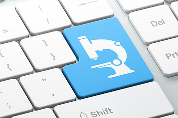 Image showing Science concept: Microscope on computer keyboard background