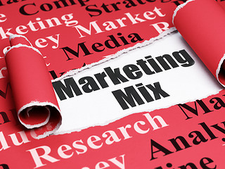 Image showing Advertising concept: black text Marketing Mix under the piece of  torn paper