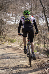 Image showing Cyclist riding mountain bike