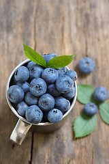 Image showing Fresh blueberries in small cup