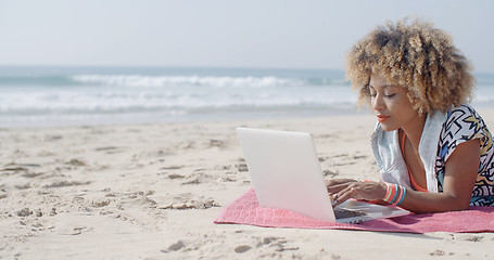 Image showing Woman At The Beach Working On A Laptop