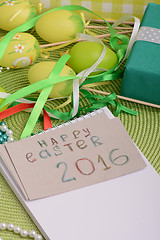 Image showing Easter eggs and invitation note. happy easter