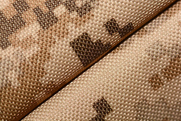 Image showing close up of worn out olive green tone camouflage fabric