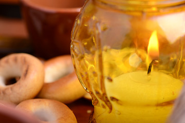 Image showing candles in glass burning romantic celecration concept wooden kitchen close up