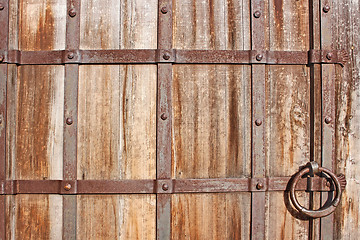 Image showing Restoring medieval wooden gate