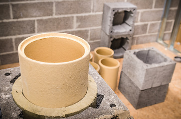 Image showing Construction of modular ceramic chimney in the house