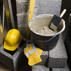 Image showing Tools for bricklayer bucket with a solution and a trowel, close-