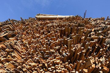 Image showing Low angle view of stacked boards