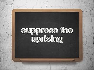 Image showing Politics concept: Suppress The Uprising on chalkboard background