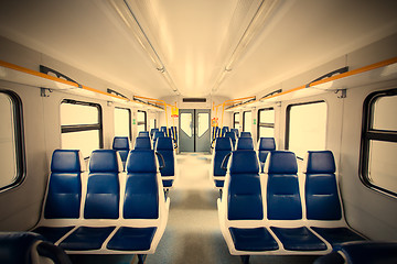Image showing Rows of seats in a passenger train carriage