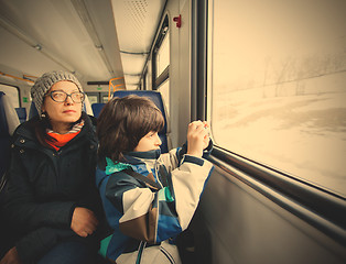 Image showing Mother and son in a railway carriage