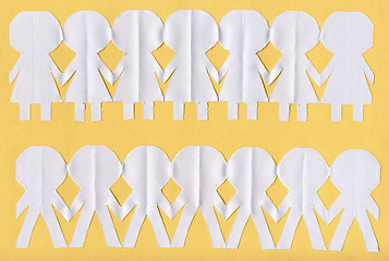 Image showing Paper people over yellow background