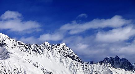 Image showing Panoramic view on snowy mountains at sun day