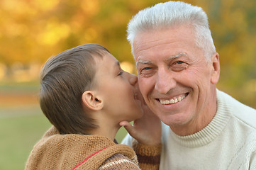 Image showing Grandfather and grandson in park