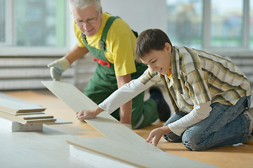 Image showing man and grandson repairing in the room