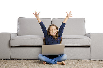 Image showing Little girl working with a laptop