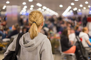 Image showing Woman waiting on airport terminal.