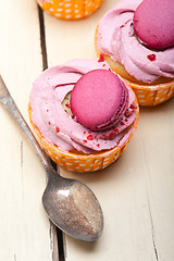 Image showing pink berry cream cupcake with macaroon on top