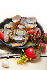 Image showing fresh clams on an iron skillet