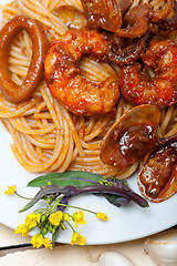 Image showing Italian seafood spaghetti pasta on red tomato sauce 